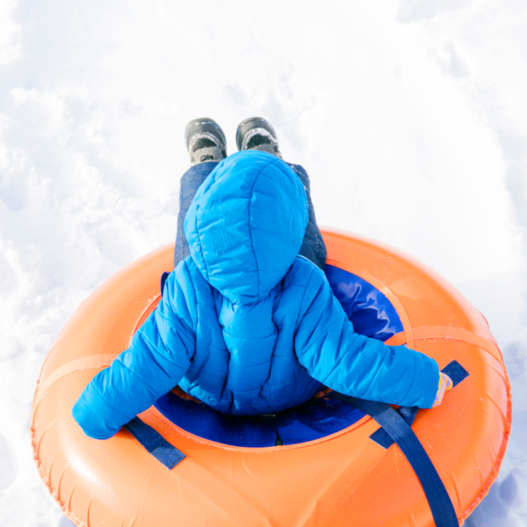 Young child snow tubing in Ohiopyle, Pennsylvania